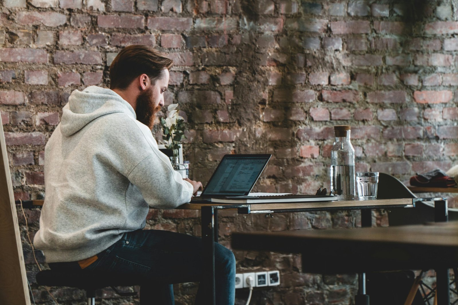 Man on laptop conveying normality