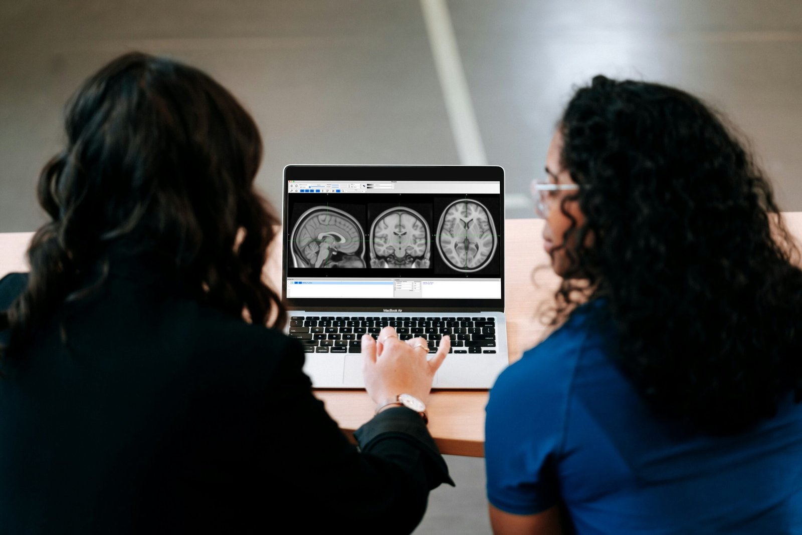 image of two nurses at a laptop showing how we operate in high trust and regulated areas