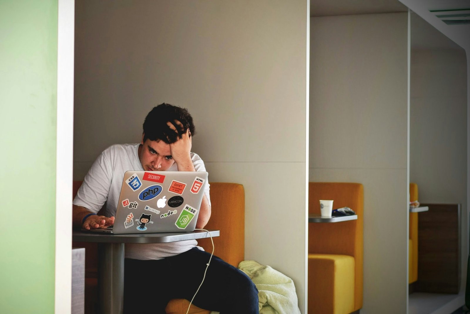 man frustrated on laptop conveying low b2b sales